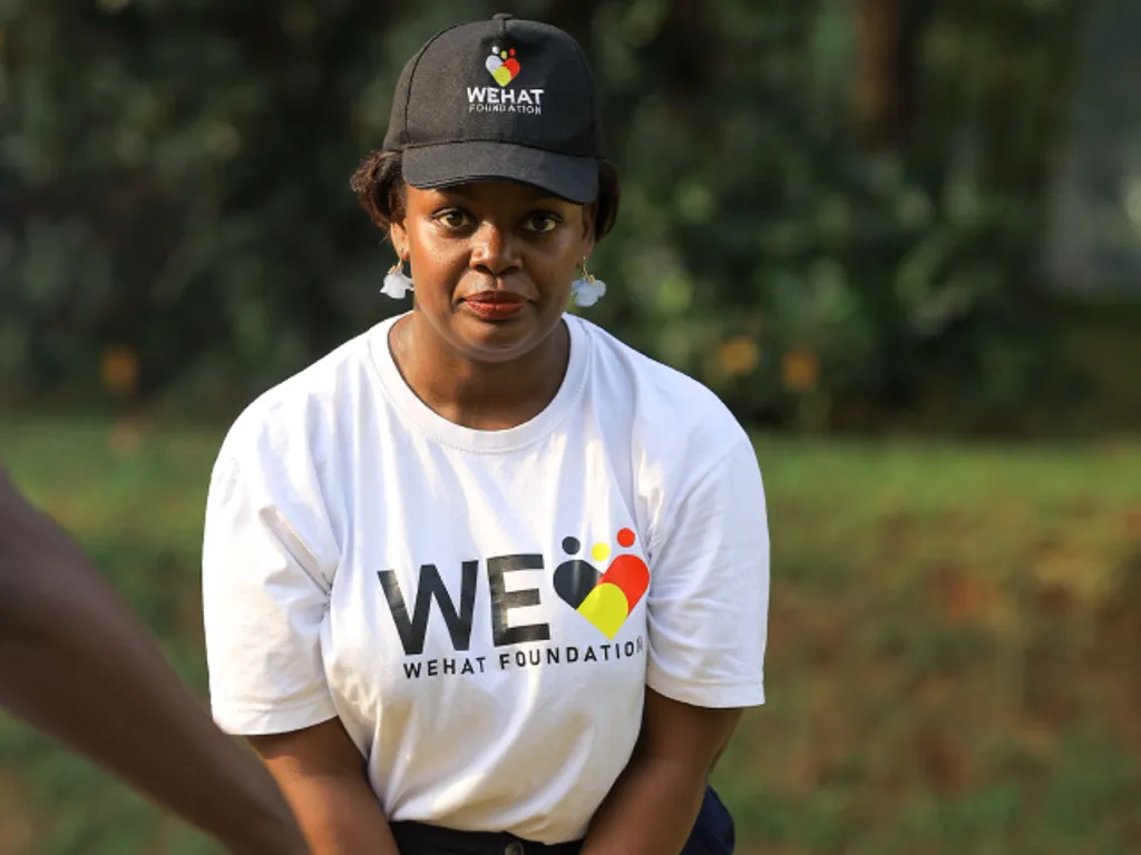 Lady playing golf during WEHAT Foundation Uganda NGO charity golf tournament and photo exhibition for education in kampala 2024